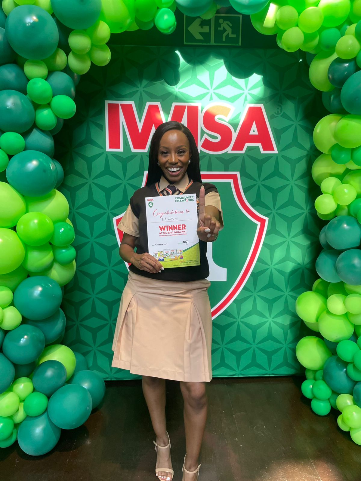 Khabo Mnguni receiving IWISA No. 1 Gauteng Community Champions Award 2025